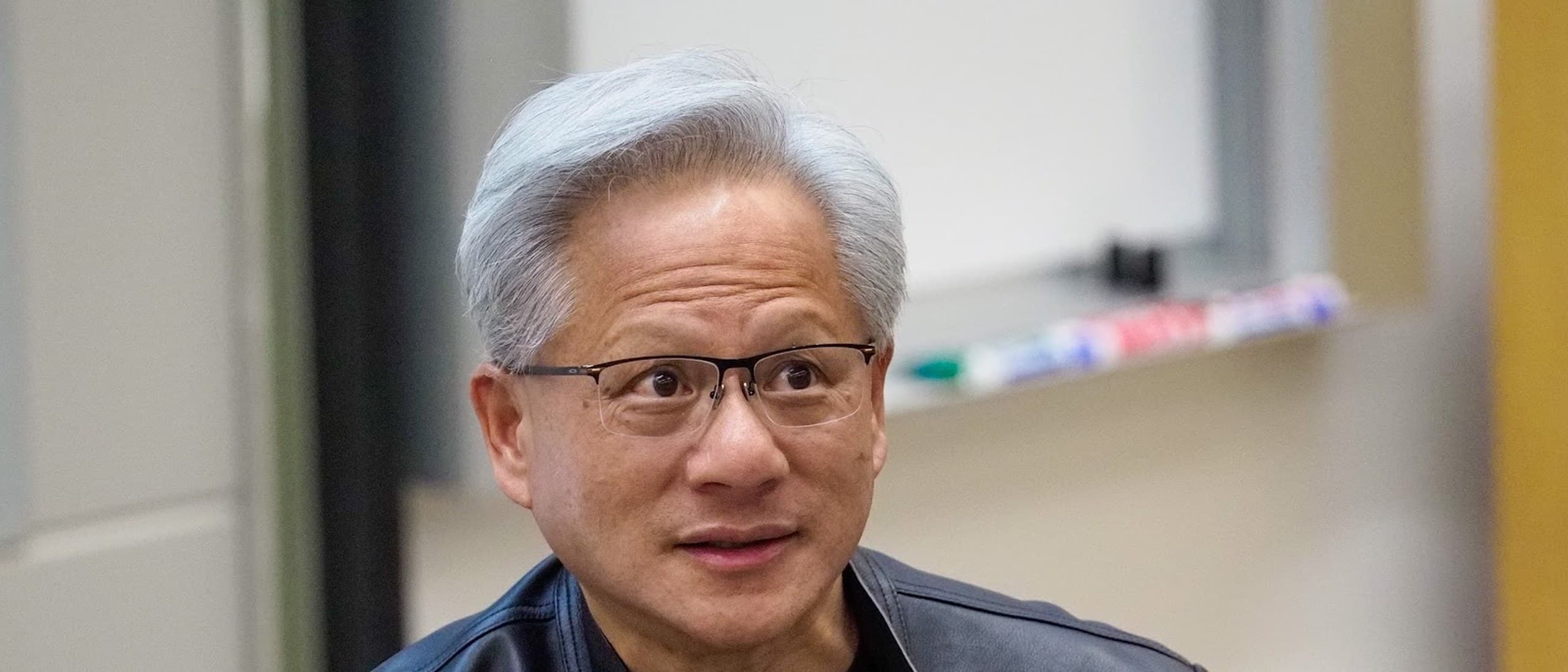 Nvidia CEO Jensen Huang in a black leather jacket at Stanford University in April 2026