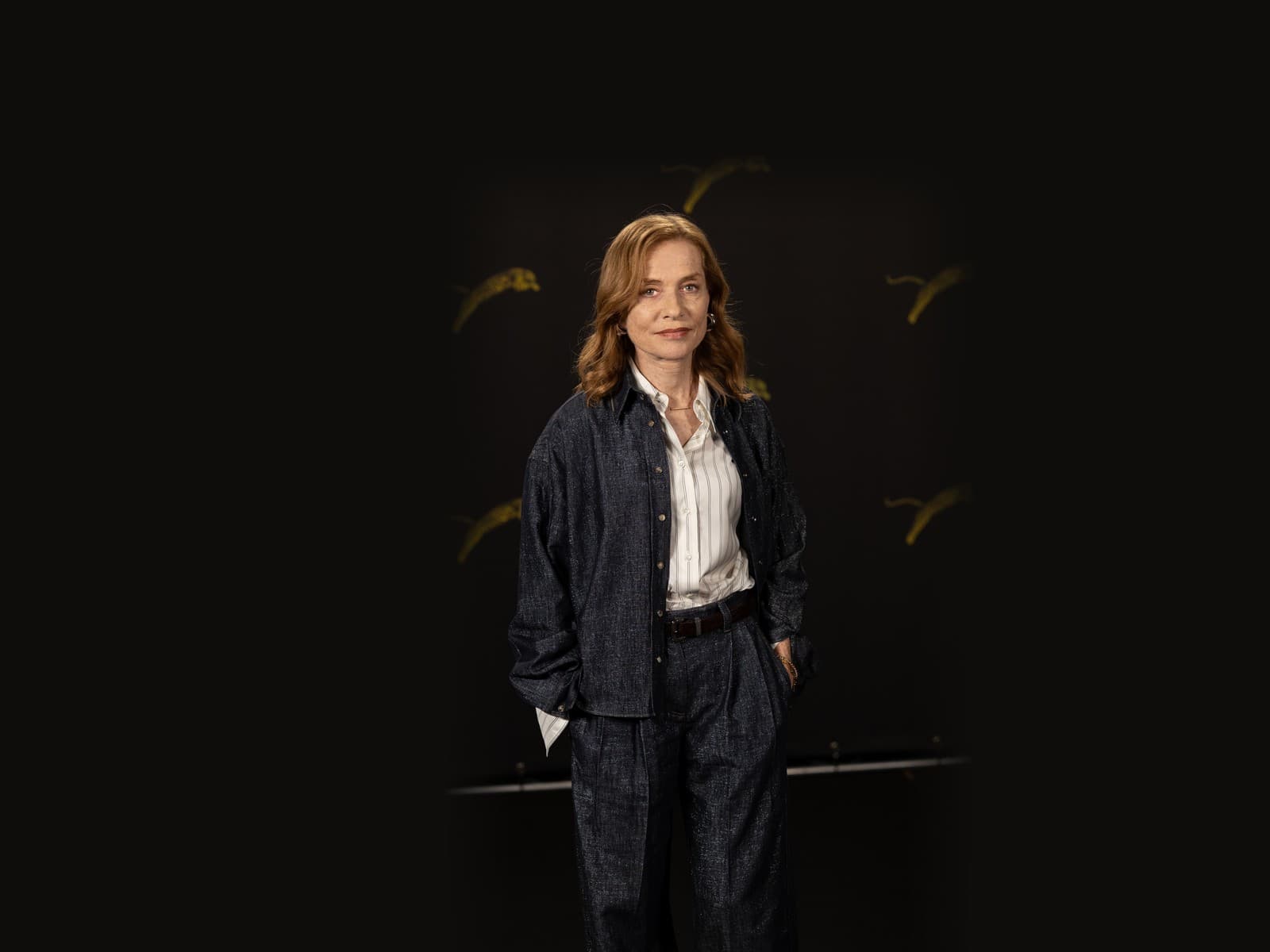 It is still Huppert's face on screen, but her voice may travel