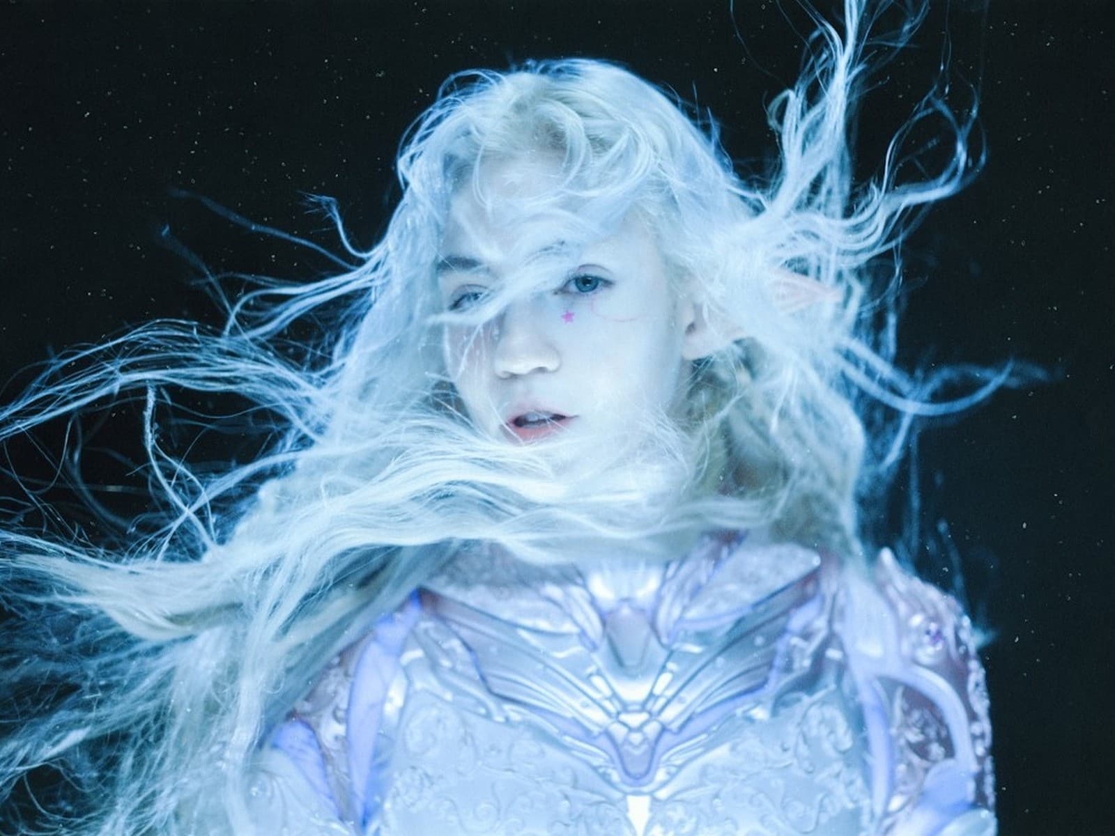 Grimes' team says AI was one tool among 70+ artists
